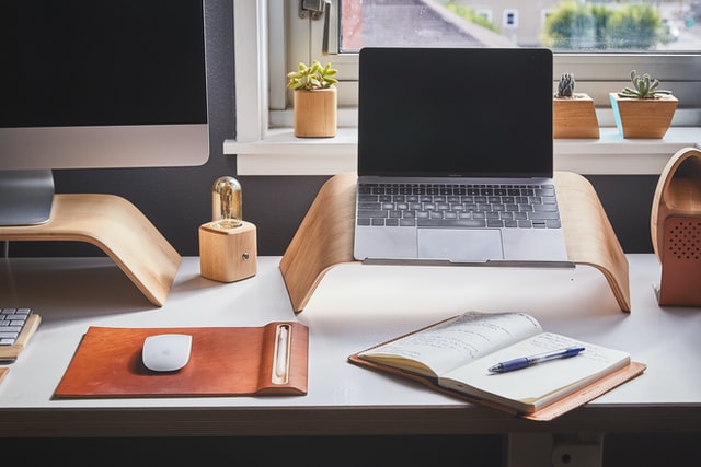 desk with laptop and desktop computer